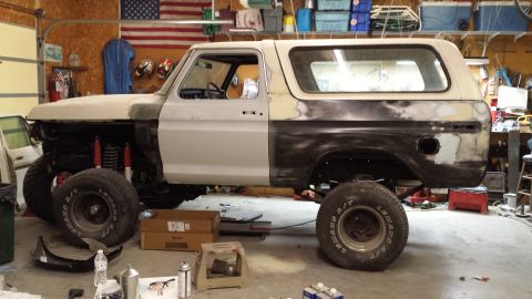 1978 Ford Bronco - This 1978 Ford Bronco is in a garage, appearing to be in the middle of a restoration or repair process.