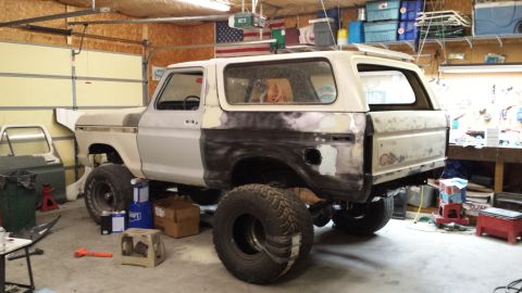 1978 Ford Bronco - This 1978 Ford Bronco is in a garage, showing signs of bodywork and repair.