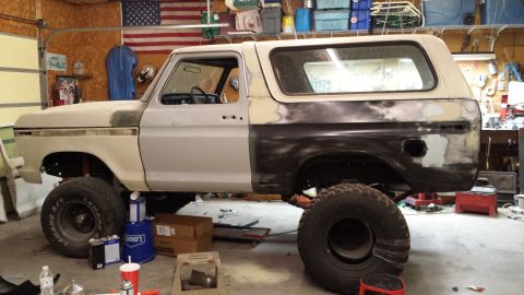 1978 Ford Bronco - This 1978 Ford Bronco is in a garage, showing signs of bodywork and repair.