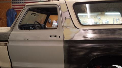 1978 Ford Bronco - Passenger side of a 1978 Ford Bronco undergoing bodywork and preparation for paint.