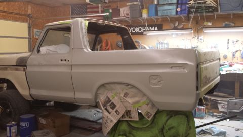 1978 Ford Bronco - This 1978 Ford Bronco is undergoing bodywork in a garage, with newspaper covering the wheel wells.