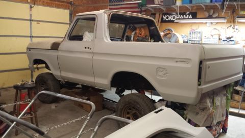 1978 Ford Bronco - This Ford pickup truck is in a garage, appearing to be in the middle of a restoration project.