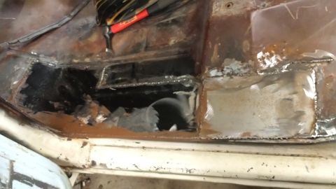 1978 Ford Bronco - Interior floor pan shows significant rust and recent welding repairs.