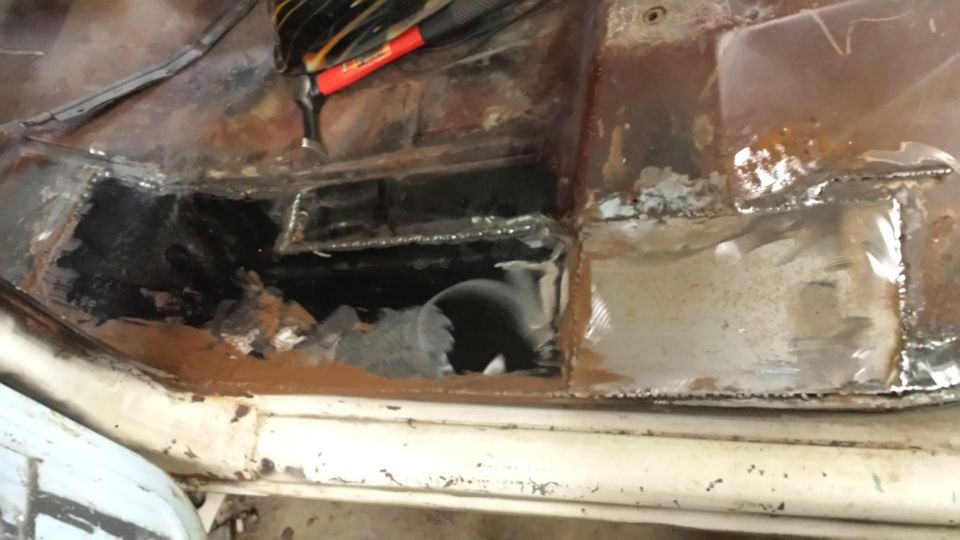 Rusted interior floor pan with welding repairs