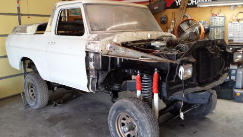 1978 Ford Bronco - This 1978 Ford Bronco is undergoing restoration, with its front end disassembled to reveal the engine and suspension components.