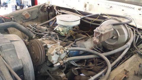 1978 Ford Bronco - Close-up view of a V8 engine bay, showing various components and wiring.