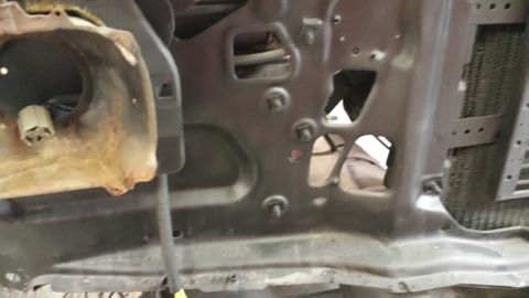 1978 Ford Bronco - This image shows the inner fender well of a vehicle, with visible rust and mounting hardware.
