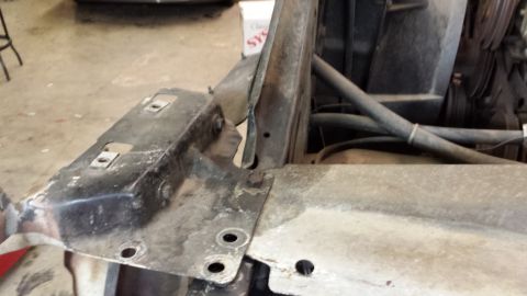 1978 Ford Bronco - Engine bay components, including metal brackets and hoses, are visible in this close-up shot.
