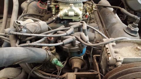 1978 Ford Bronco - Close-up view of an engine compartment, showing various mechanical components.