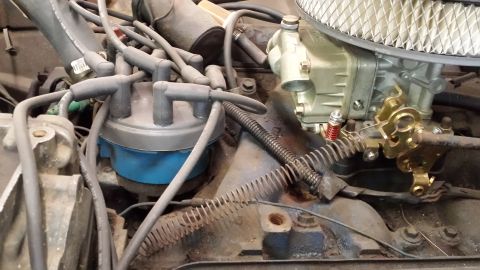 1978 Ford Bronco - Engine distributor cap and carburetor are visible in this close-up shot.