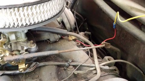 1978 Ford Bronco - A close-up view of engine components, including a carburetor and various wires, with a watermark from supermotors.net.
