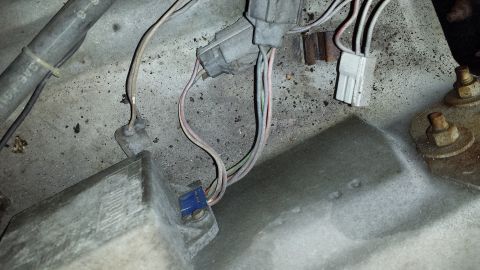 1978 Ford Bronco - Engine bay wiring harness with various electrical connectors and frayed wires visible.