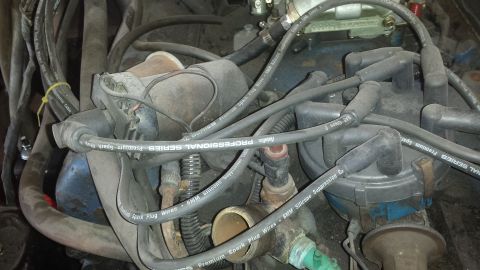 1978 Ford Bronco - Engine bay detail with distributor and spark plug wires visible.