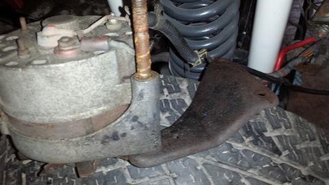 1978 Ford Bronco - Close-up view of an alternator and suspension components, not a complete vehicle.