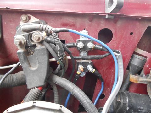 1992 Ford Bronco - Vehicle electrical relays and wiring harness connections are visible in this close-up view.