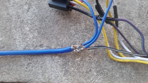 1985 Ford Bronco - Electrical wiring splice with multiple colored wires and a black connector.