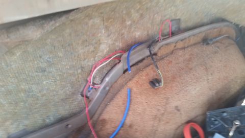 1985 Ford Bronco - Exposed wiring and carpet are visible inside the vehicle's interior.