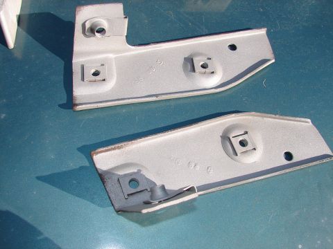1973 Ford Ranchero - Two gray metal brackets with square mounting holes are shown, possibly for a vehicle part.