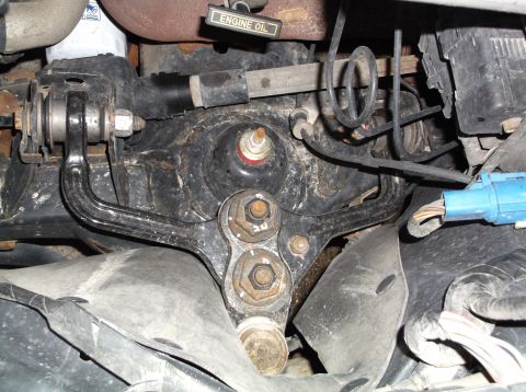 1999 Mercury Grand Marquis - Close-up view of engine oil filter and suspension components with visible wiring.