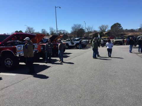 1979 Ford Bronco - A gathering of SUVs with their hoods open, suggesting a car show or meet-up event.