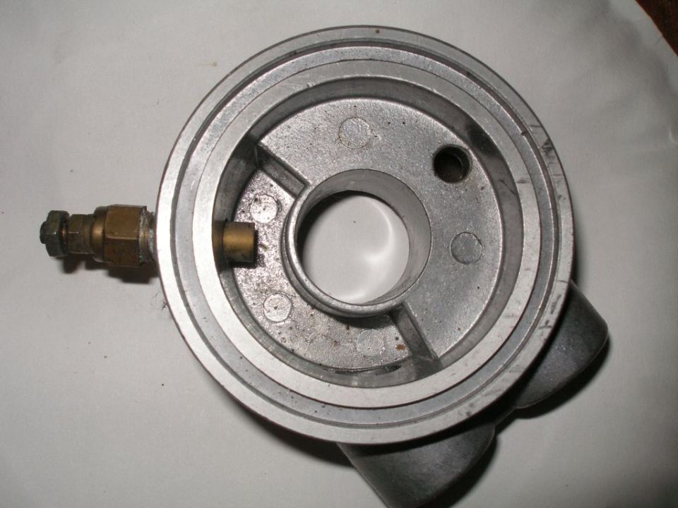 Metal oil filter housing adapter with brass fittings