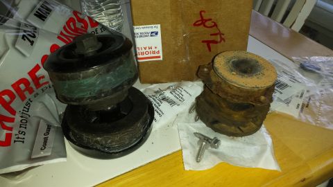 1991 Buick Reatta - Two engine mounts are shown on a table, one appears newer than the other.