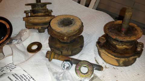 1991 Buick Reatta - Several used engine mounts and associated hardware are laid out on white towels.
