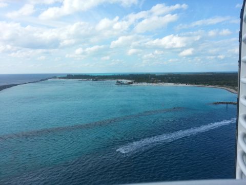 2007 Ford F-250 - View of a tropical coastline from a high vantage point, showing clear blue water and a boat's wake.