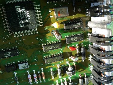 1995 Ford Bronco - A detailed view of an electronic circuit board, various components like integrated circuits, capacitors, and resistors.