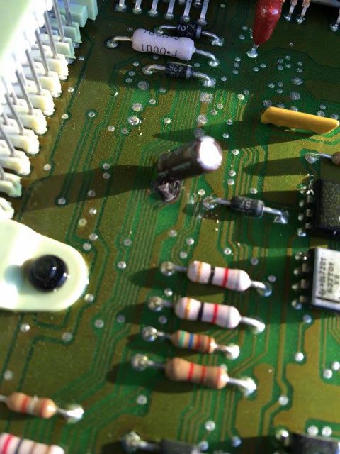 1995 Ford Bronco - Electronic components on a circuit board, including resistors and capacitors, are visible in this close-up view.