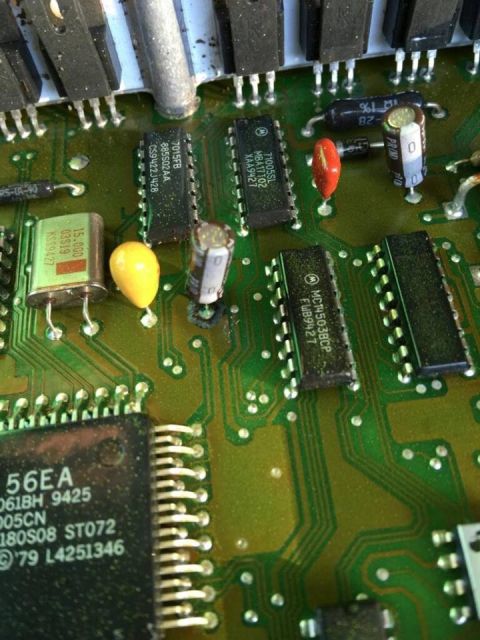 1995 Ford Bronco - A detailed view of an electronic circuit board, showing integrated circuits and other electronic components.
