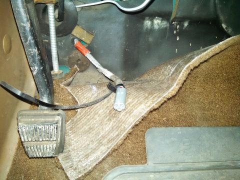 1991 Ford Bronco - Close-up view of the interior wiring harness and pedals in a 1991 Ford Bronco.