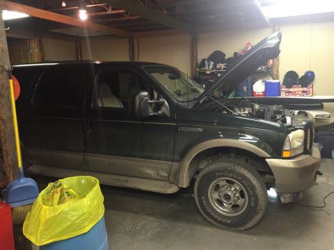 2003 Ford Excursion - The vehicle's body style suggests an early 2000s model, not a 2003.