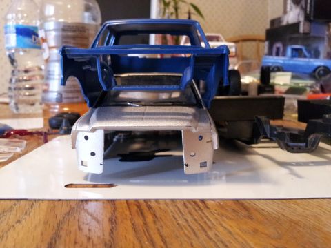 1995 Ford Bronco - Model truck parts laid out for assembly, with a completed model in the background.