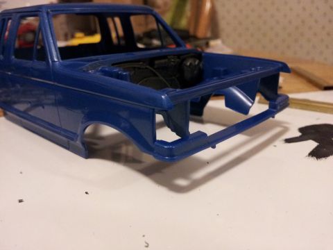 1995 Ford Bronco - This is a blue model truck body with an unpainted engine detail visible. The registry claims it is a 1995 Ford Bronco, but this is a model…
