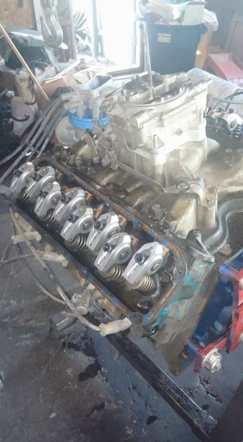 1979 Ford Bronco - Close-up of a V8 engine's internal components, including the carburetor and rocker arms.