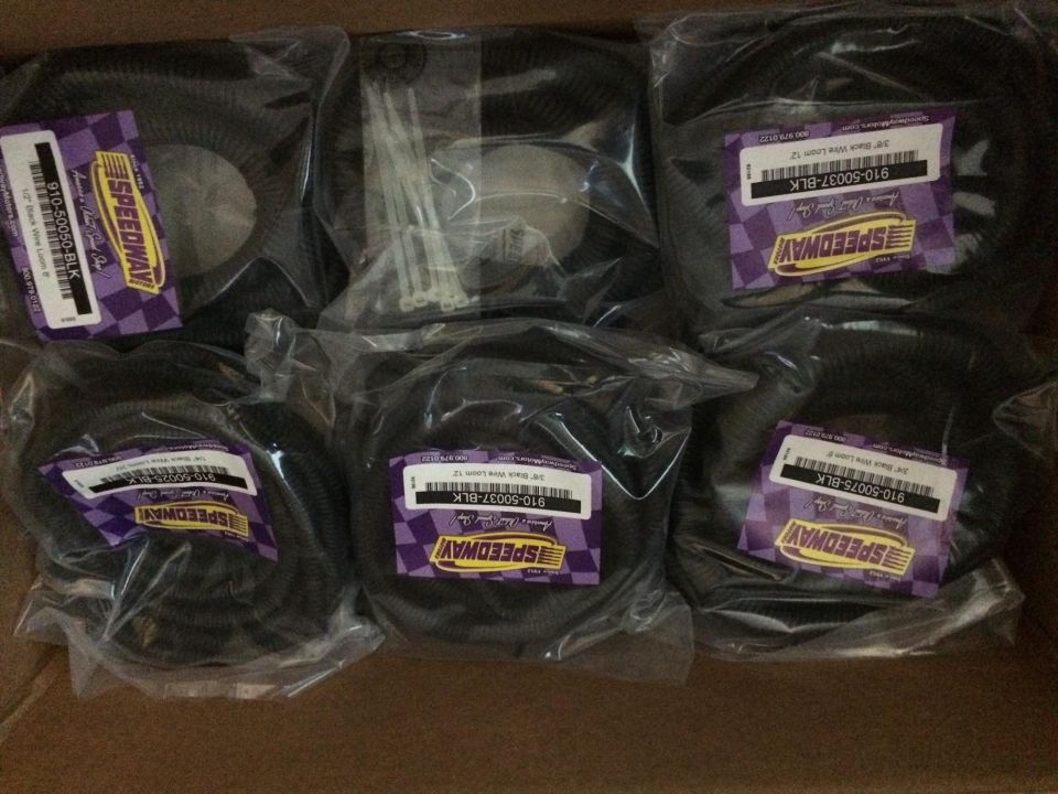 Box of Speedway brand wire loom and zip ties. Part numbers visible include 910-50050-BLK and 910-50037-BLK