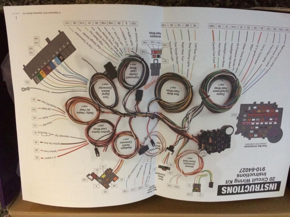 Aftermarket 20-circuit wiring kit instruction sheet beside the labeled wiring harness