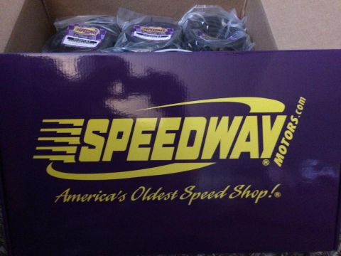 Purple Speedway Motors box with yellow lettering and three bagged parts inside a cardboard box
