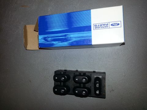 2003 Mercury Marauder - A power window switch assembly is shown next to a Ford Genuine Parts box.