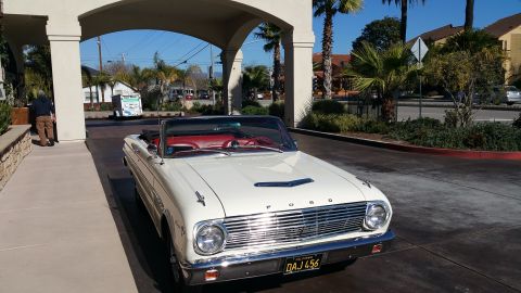 1963 Ford Falcon - This 1963 Ford Falcon convertible features a distinctive grille and a bright red interior.