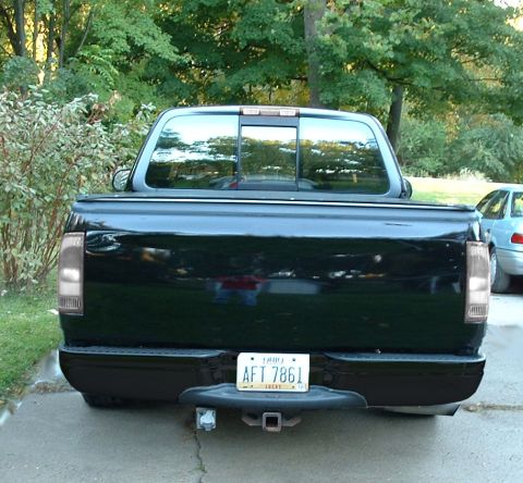 1992 Ford Taurus - my dads truck, shaved emblems, tailgate sealed shut, shaved handle, killed chrome, clear lenses, lowered