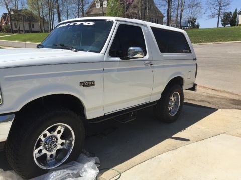 1995 Ford Bronco - This 1995 Ford Bronco is shown from the front three-quarter view, parked outdoors.