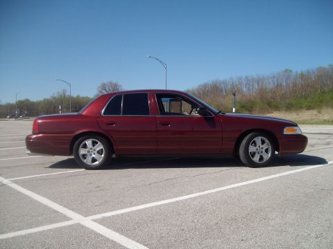 2004 Ford Crown Victoria - Lowered 2004 Ford Crown Victoria parked on a sunny day.