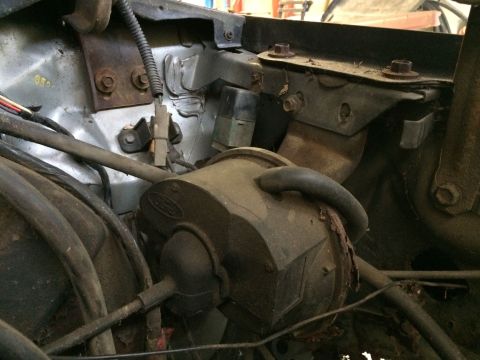 1986 Ford Bronco - Close-up view of engine bay components, including a part with a visible Ford logo.