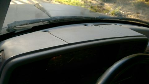 1991 Ford F-250 - View from inside a truck, looking over the dashboard towards the hood and windshield.