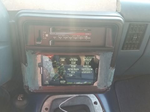 1988 Ford Bronco - Aftermarket screen installed in the dashboard displays GPS coordinates and orientation data.