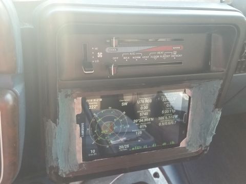 1988 Ford Bronco - Aftermarket GPS unit installed in the dashboard, replacing original radio.