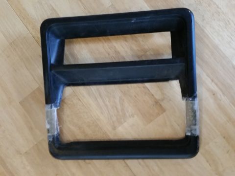 1988 Ford Bronco - This is a part, possibly a grille surround, with tape on its lower edges.