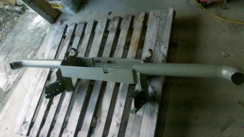 1989 Nissan Patrol - This painted bumper assembly with tow hooks is shown on wooden pallets.